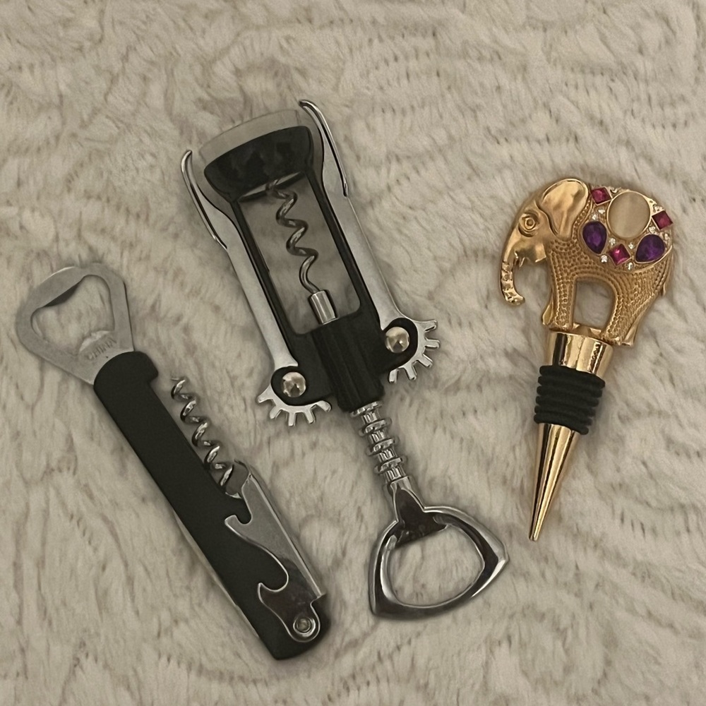 Set of two wine openers and jeweled wine stoppers